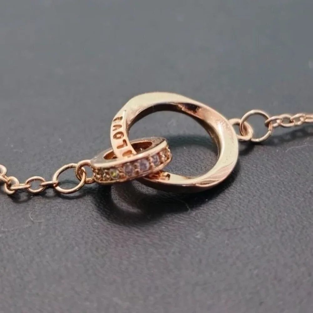 Interlocking Mobius Engraved Necklace‎ in Rose Gold (NWOT)